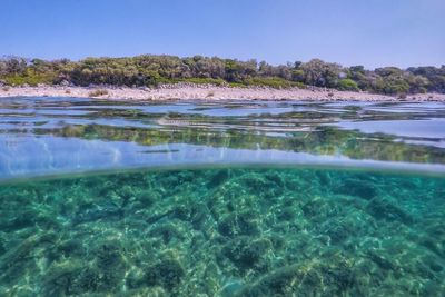 Surface level of swimming pool against sea