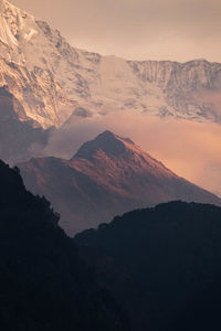 Scenic view of mountains against sky during sunset