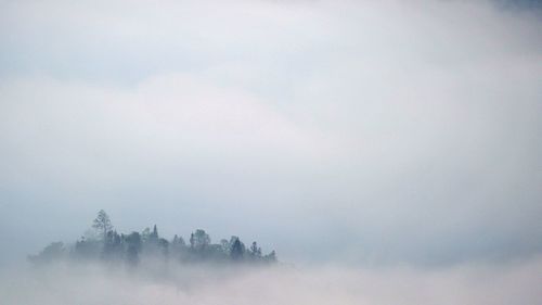 Scenic view of fog against sky