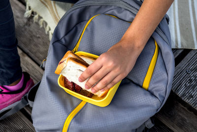 Midsection of man holding food