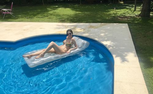 Woman swimming in pool