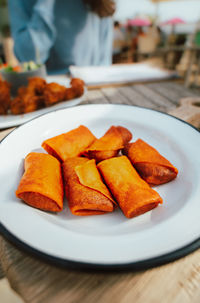 Close-up of snacks in plate on table