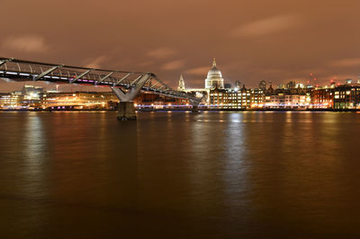 Illuminated city at waterfront