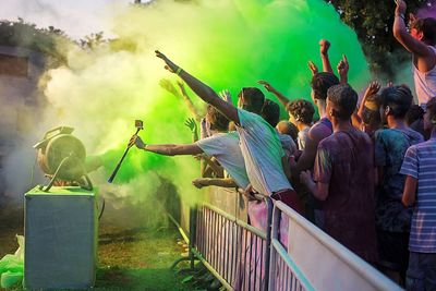 People enjoying with colors during festival