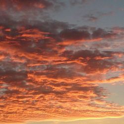 Scenic view of cloudy sky at sunset