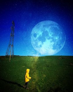 Scenic view of moon on field against sky