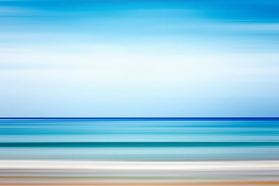 Scenic view of sea against blue sky