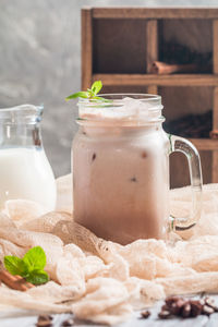 Close-up of drink in glass jar on table