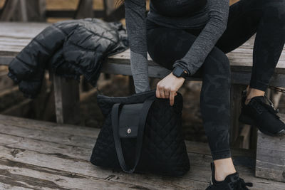 Woman's hands holding bag