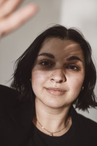 Portrait of young woman in studio