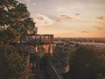 Built structure against sky at sunset