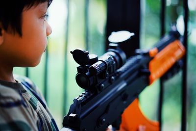 Close-up of boy looking at camera