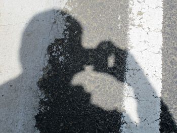 Shadow of man on hand