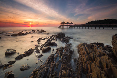 Panoramic view of sea against sky at sunset