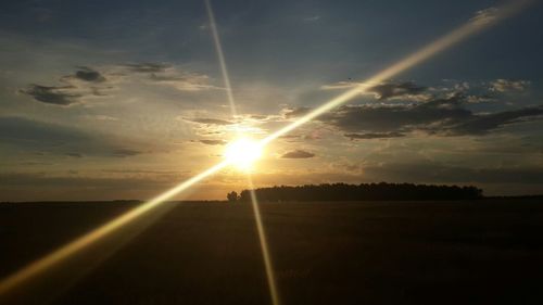 Sun shining through clouds