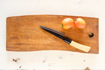 High angle view of fruits on cutting board