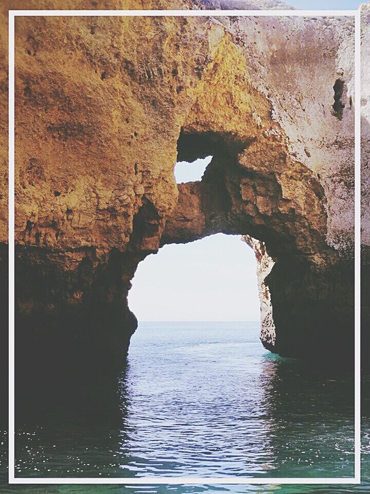 water, sea, rock formation, tranquility, transfer print, scenics, tranquil scene, beauty in nature, rock - object, waterfront, nature, cliff, auto post production filter, rock, horizon over water, idyllic, rippled, day, outdoors, no people