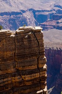 Scenic view of cliff by rocky mountains at grand canyon
