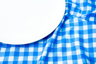 High angle view of blue glass on table