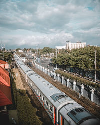 High angle view of train against buildings in city