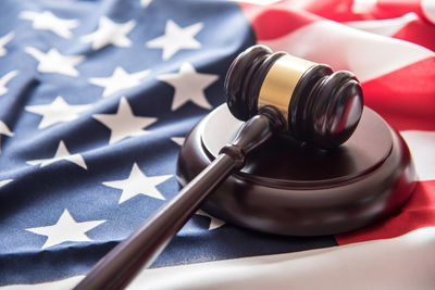 Close-up of gavel on american flag