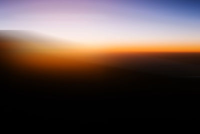 Scenic view of silhouette landscape against sky during sunset