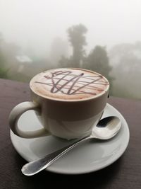 Close-up of cappuccino on table