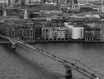 High angle view of bridge over river against buildings