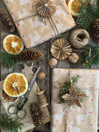 Wrapping christmas gifts with cozy paper in scandi style