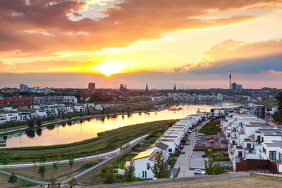 High angle view of city at sunset