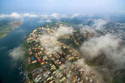 Aerial view of cityscape by river