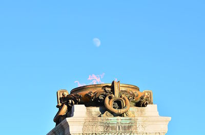 Low angle view of statue against clear sky