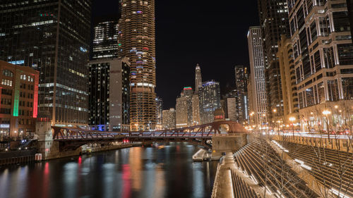 Illuminated buildings in city at night