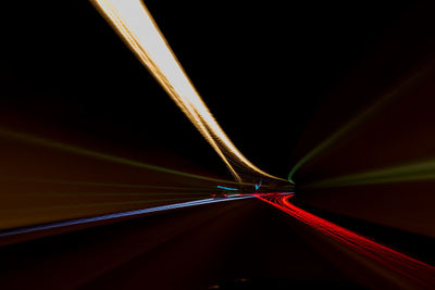 Full frame shot of illuminated glass against black background