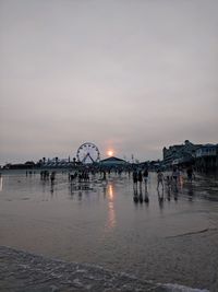 Scenic view of beach against sky during sunset