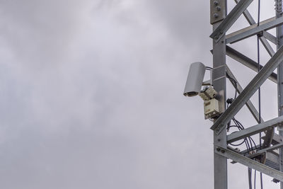 Cctv cameras on tile building exterior with copy space. surveillance concept.