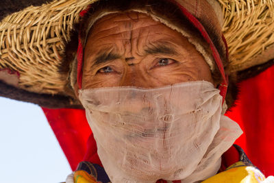 Close-up portrait of man wearing hat