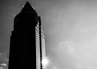 Low angle view of building against cloudy sky