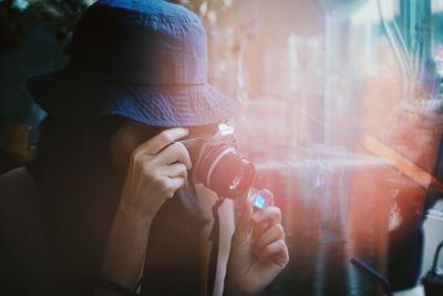 Close-up of woman photographing product