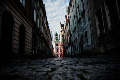 Street amidst building leading towards church