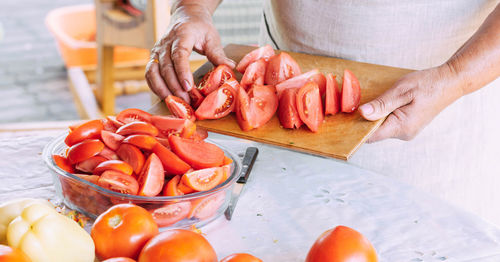 Midsection of man preparing food