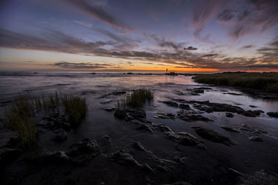 Scenic view of sea against sky during sunset