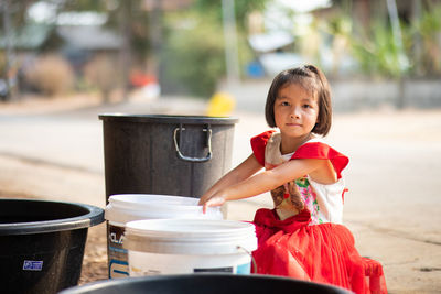 Portrait of cute girl standing outdoors