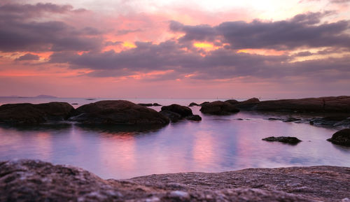 Scenic view of sea against sky at sunset