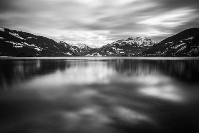 Scenic view of lake and mountains against sky