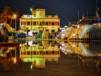 Reflection of building in puddle