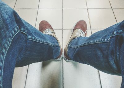 Low section of man standing on floor