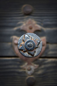 Close-up of metal on wooden door