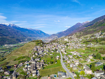 High angle view of townscape and mountains against sky