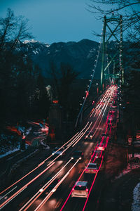 High angle view of light trails on road at night